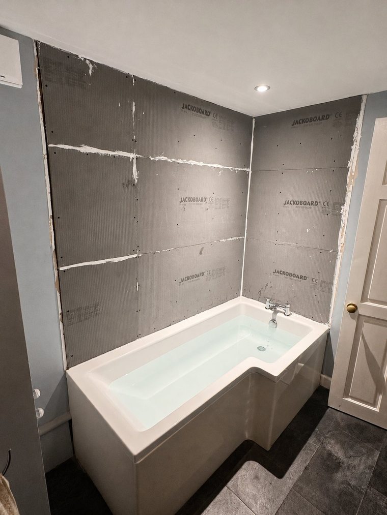 Waterproof tile-backer boards installed before tiling